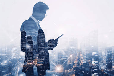 A man standing in front of a city with a cell phone