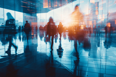 A group of people walking through a lobby
