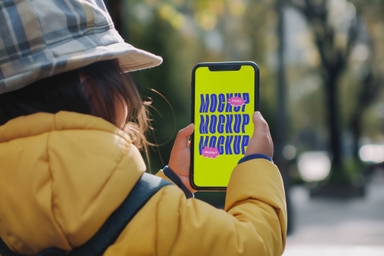 Little Girl Using smartphone Mockup While Walking