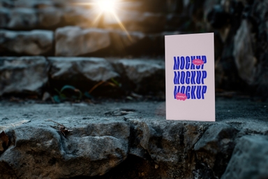 Vertical Paper Mockup Placed on Rocky Stairs
