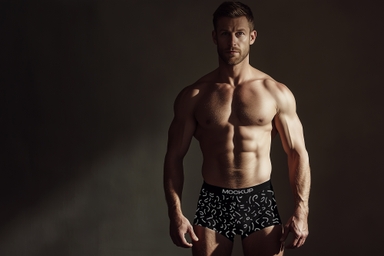 Muscular Man Showcasing Boxer Mockup