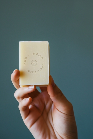 Hand Holding Vertical Soap Mockup
