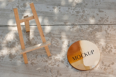 Round Canvas Mockup with Easel on Concrete Floor