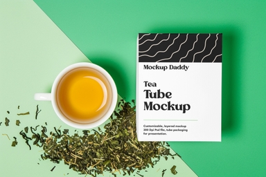 Tea Packaging Box Mockup with White Cup and Loose Leaves