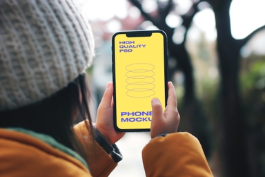 Little Girl Using iPhone PSD Mockup