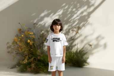 Asian Child in T-Shirt and Shorts Mockup with Botanical Background