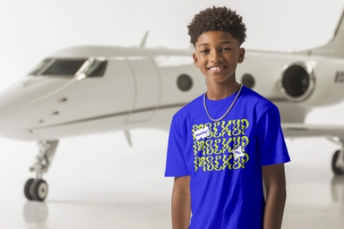 Rich African American Boy Showing T-shirt Mockup by Private Jet