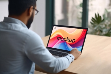 Man Displays MacBook Screen PSD Mockup