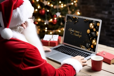 Santa Claus Displays MacBook Screen Mockup