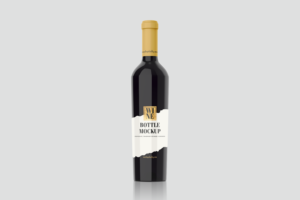 Premium Wine Bottle Psd mockup in black color with white label and brown cap.