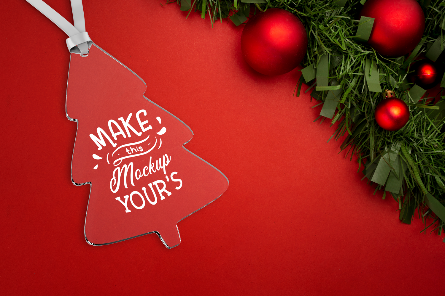 3D mockup of a transparent acrylic Christmas tree ornament with a red ribbon