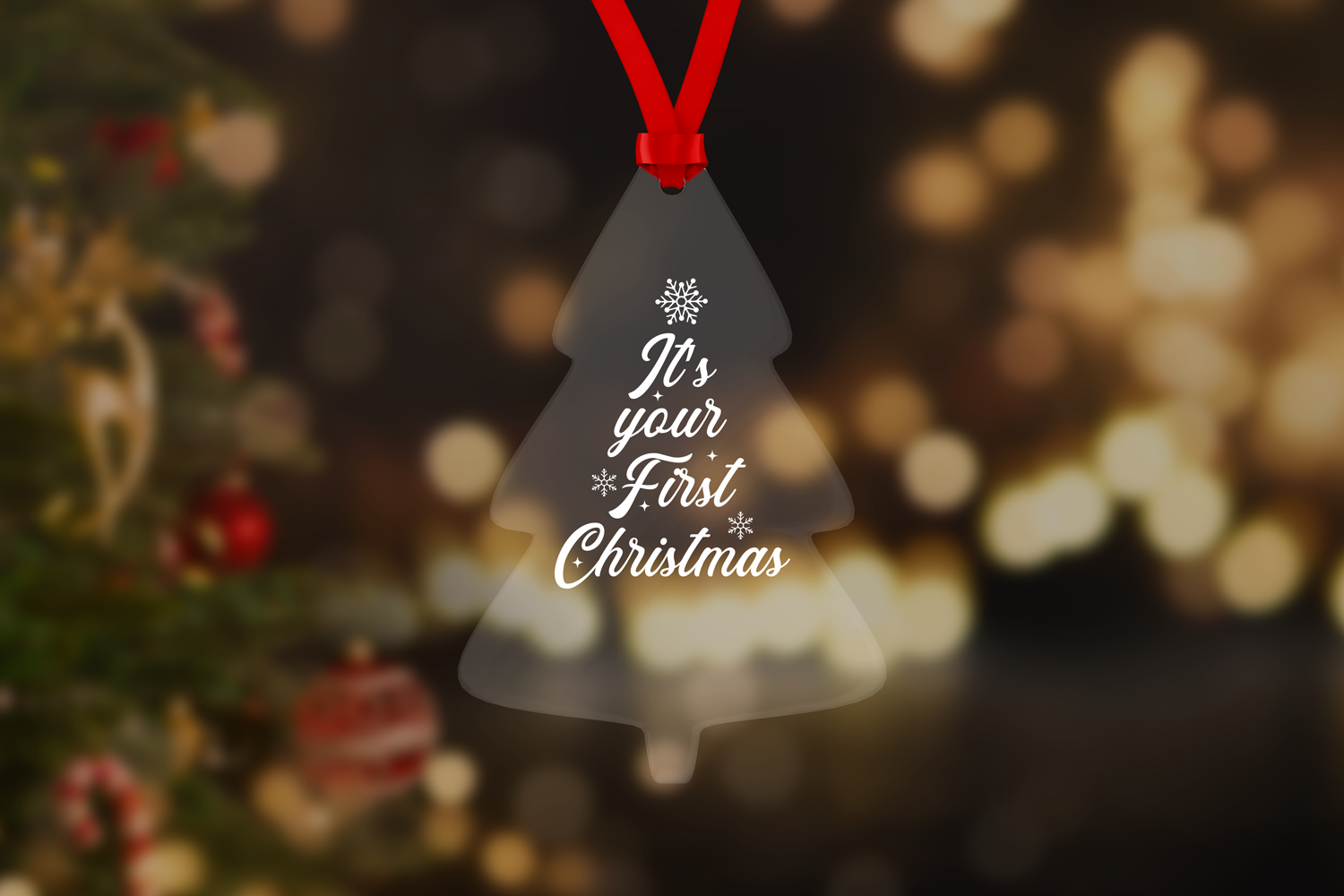 Transparent acrylic Christmas tree ornament mockup with a red ribbon