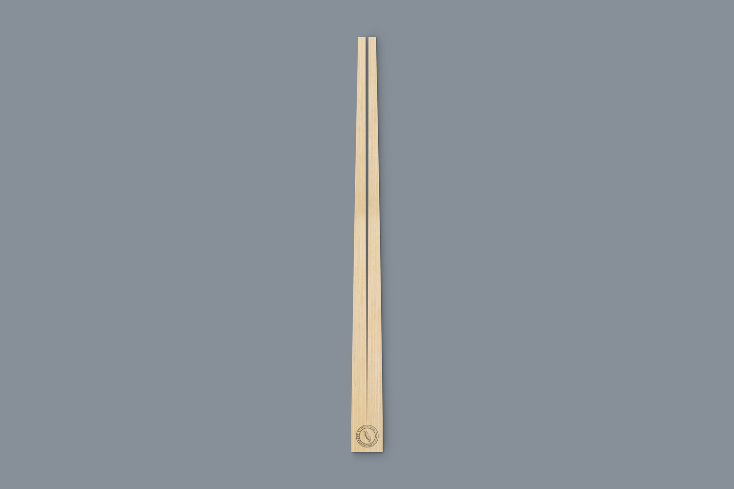 Digital mockup of two wooden chopsticks in open packaging.