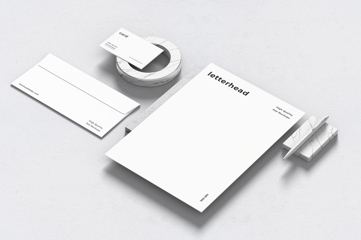 Black and white branding mockup with envelopes, cards, and letterhead