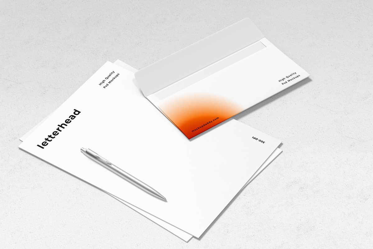 Black and white branding mockup with letterhead, envelope, and pen on marble background