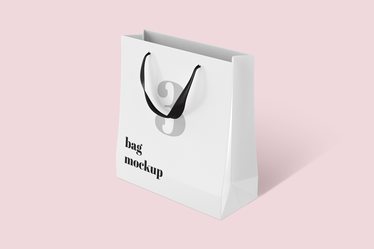  White Paper Bag PSD Mockup with black handle on pink background 