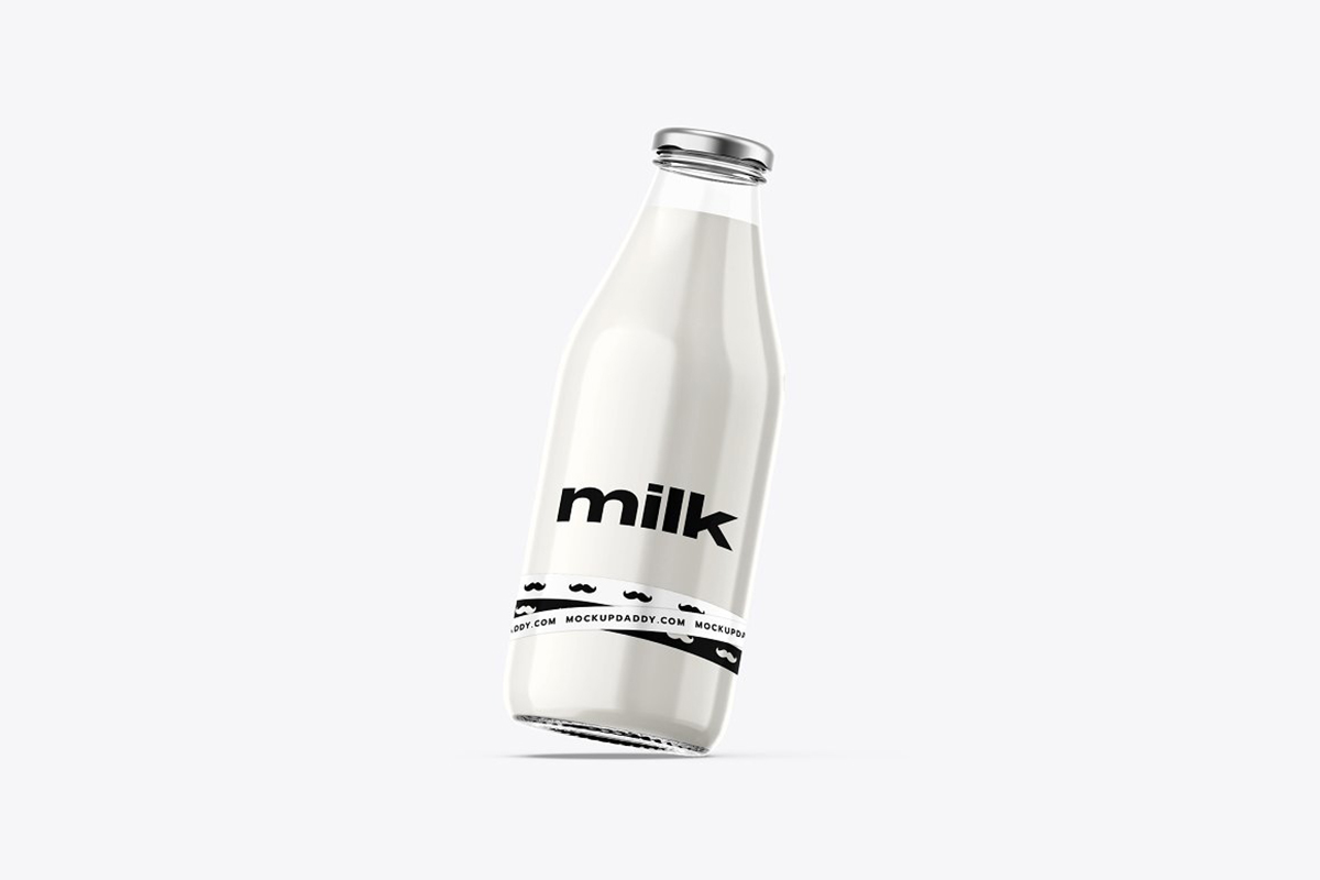 Transparent glass bottle filled with milk, PSD mockup.