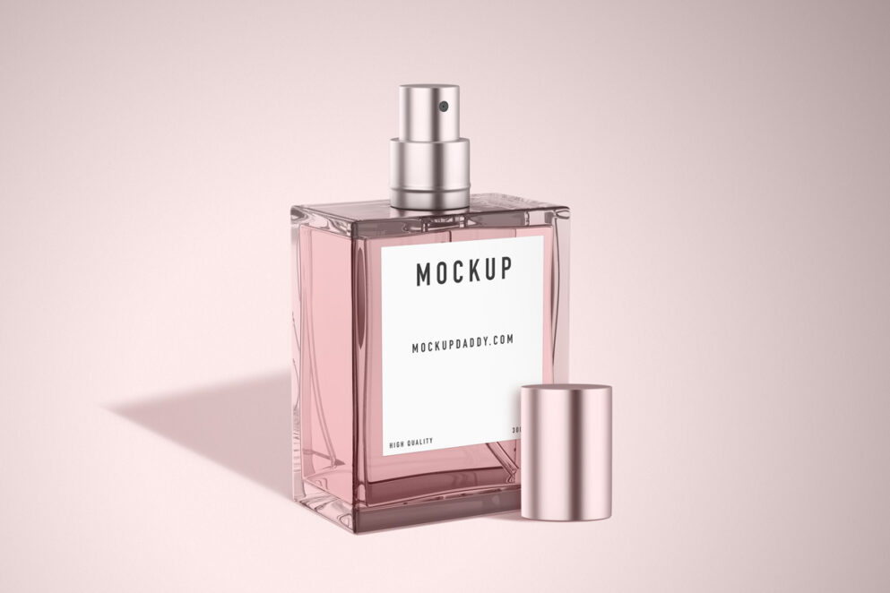 Mockup of a pink glass perfume bottle with a open pink cap 