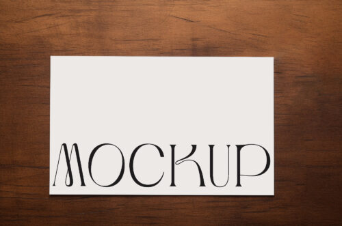 Business card mockup top view wood background