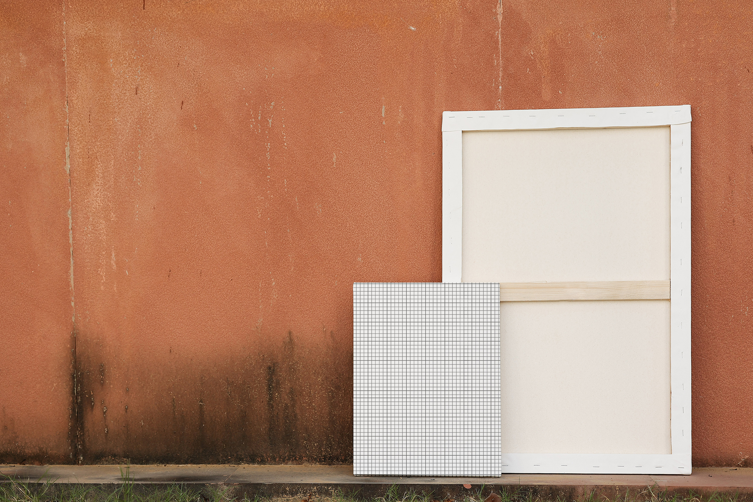 Free Download Canvas mockup with cracked sandstone wall background grid