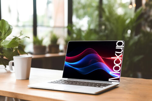Laptop mockup on wooden desk with mug