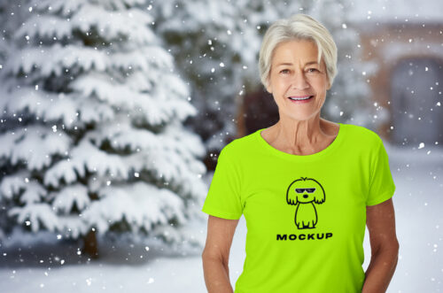 Old woman wearing christmas t-shirt mockup snow covered yard background-