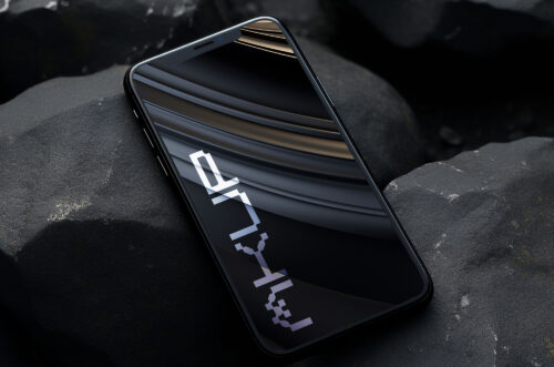 Phone PSD mockup on black rock-