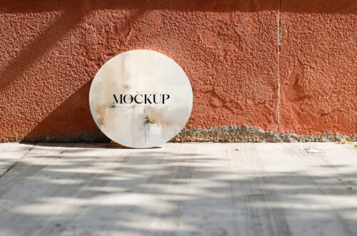 Round canvas mockup on concrete floor cracked sandstone wall-MD