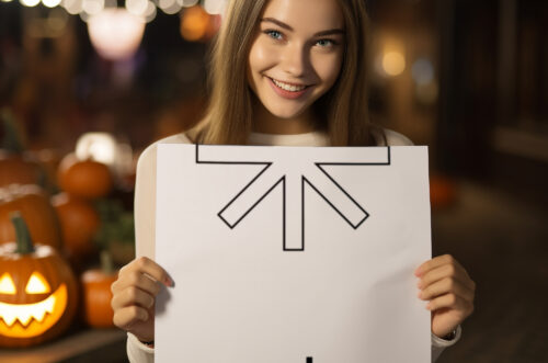 Young woman holding square paper mockup with halloween background