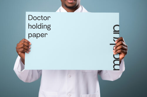 Doctor holding paper PSD mockup-