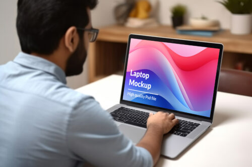 Free Download Young man working on laptop hd mockup